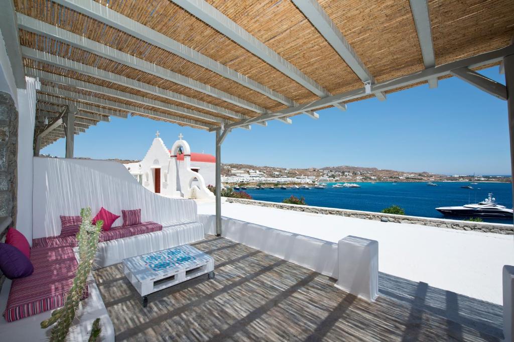 a balcony with a view of the water at Mykonos Azure in Psarou