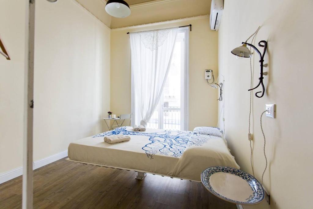 Postel nebo postele na pokoji v ubytování Artisan Maison Palermo