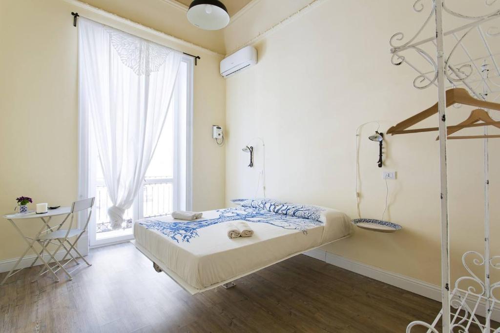 Postel nebo postele na pokoji v ubytování Artisan Maison Palermo