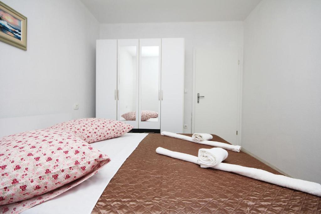 Posteľ alebo postele v izbe v ubytovaní Apartmani Lovre
