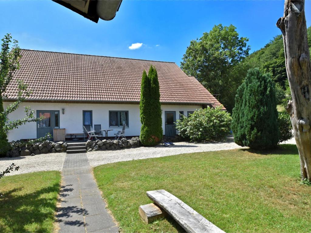 a house with a bench in front of it at Apartment with private terrace in H ddinge in Bad Wildungen