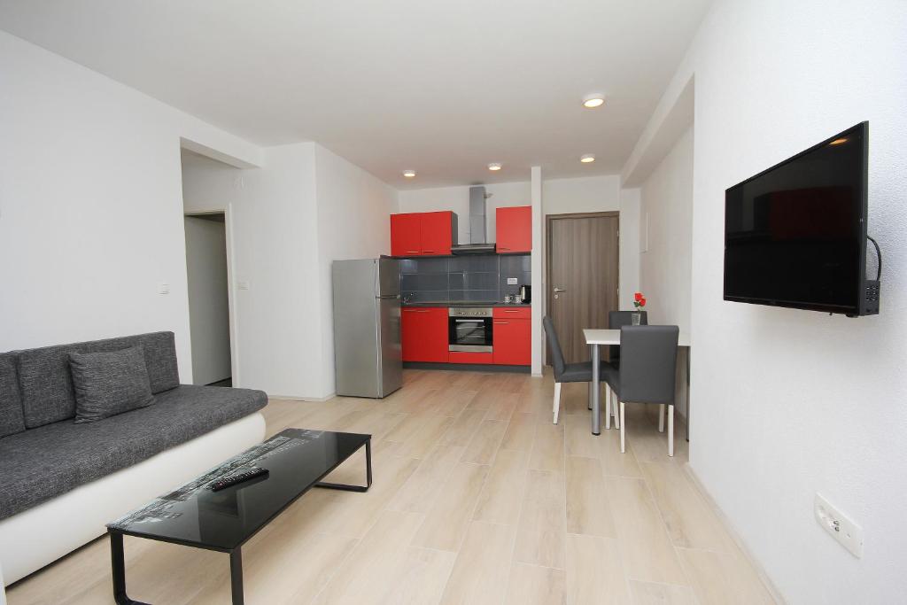 Kuchyňa alebo kuchynka v ubytovaní Apartmani Lovre