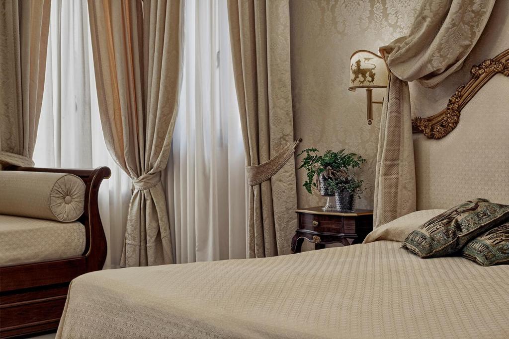 Posteľ alebo postele v izbe v ubytovaní B&B Ca' Bonvicini