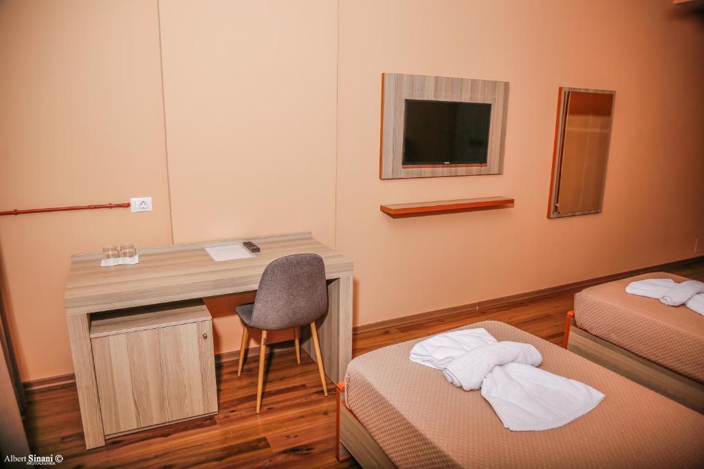 Postel nebo postele na pokoji v ubytování Arc Hotel Tirana