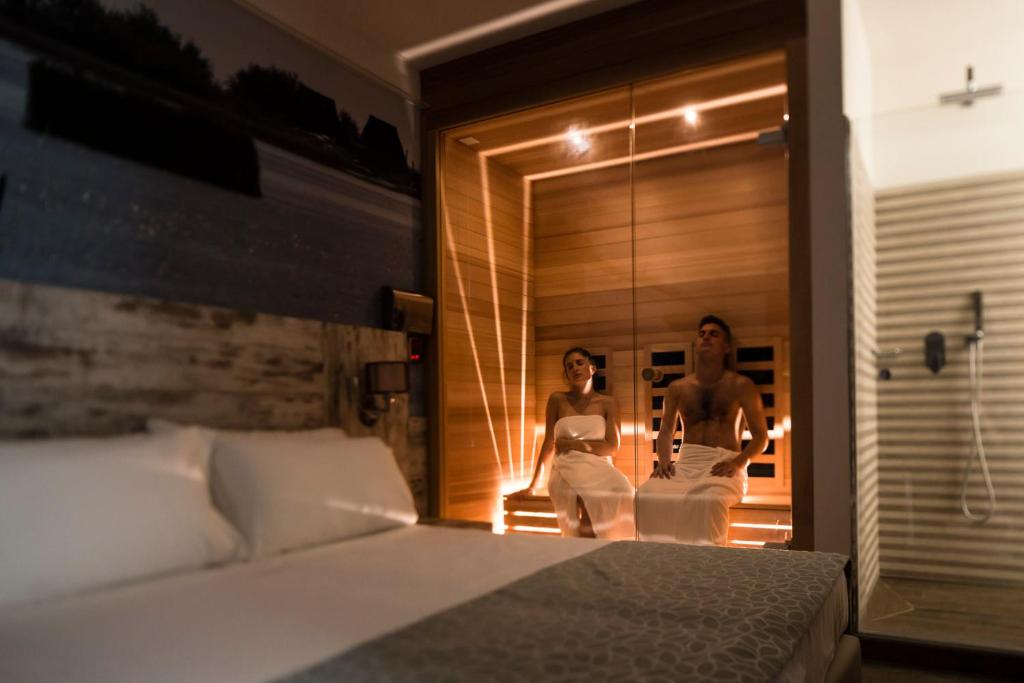 Postel nebo postele na pokoji v ubytování Hotel Ambassador