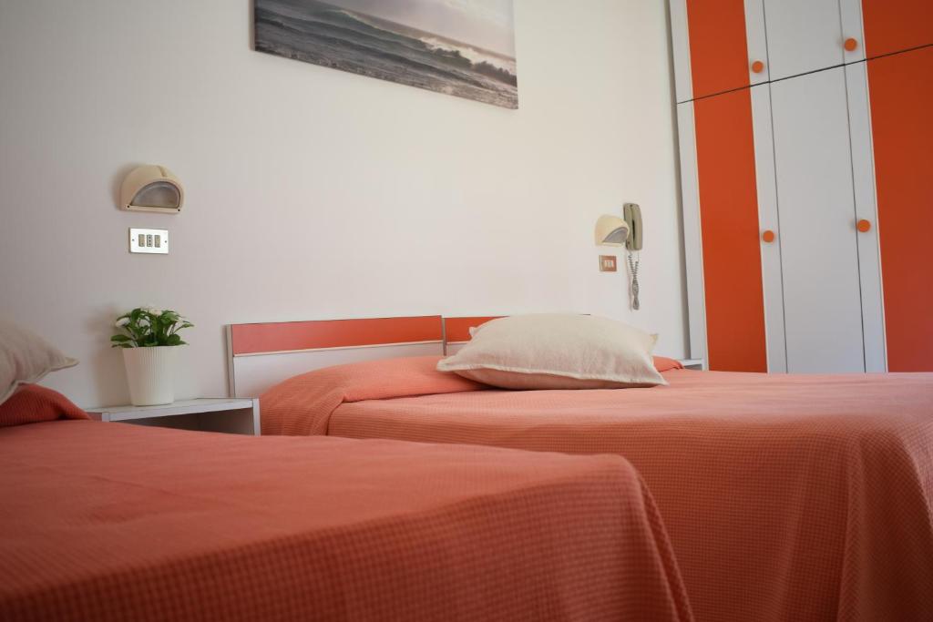 Postel nebo postele na pokoji v ubytování Hotel Calypso