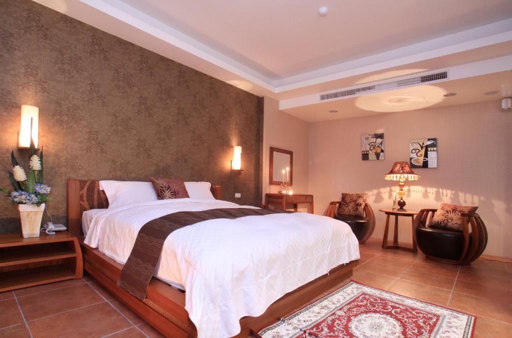 Postel nebo postele na pokoji v ubytování Spring Fountain Hotel