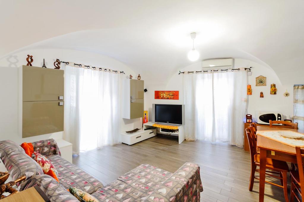 Televízia a/alebo spoločenská miestnosť v ubytovaní Catania Central Flat