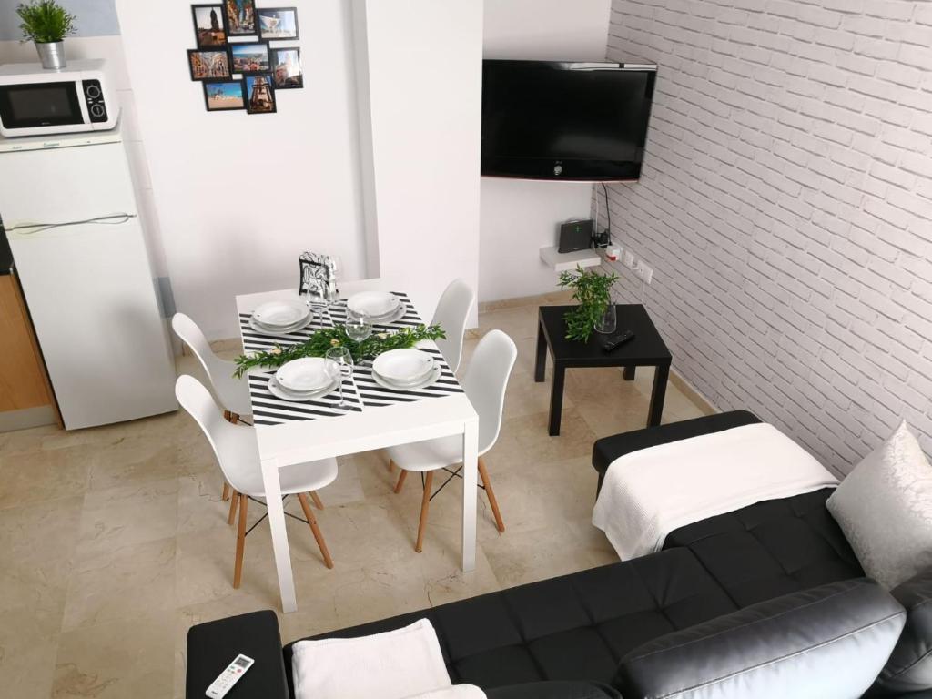 A television and/or entertainment centre at Apartamento La Victoria