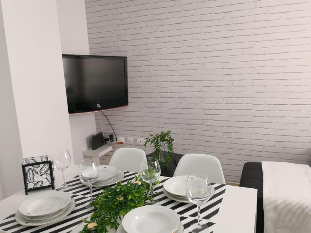 A television and/or entertainment centre at Apartamento La Victoria