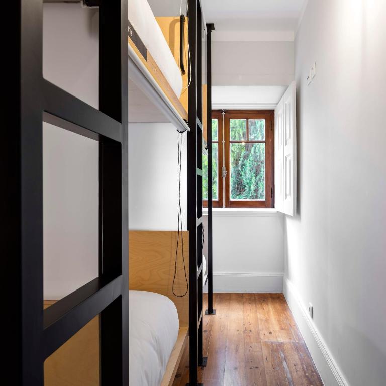 Postel nebo postele na pokoji v ubytování Penedo da Saudade Suites & Hostel