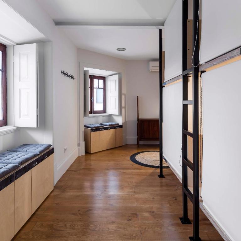 Postel nebo postele na pokoji v ubytování Penedo da Saudade Suites & Hostel