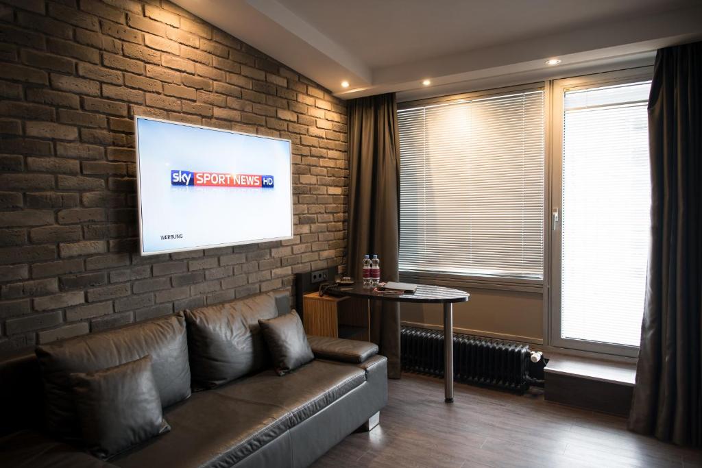 TV a/nebo společenská místnost v ubytování Hotel Munich City
