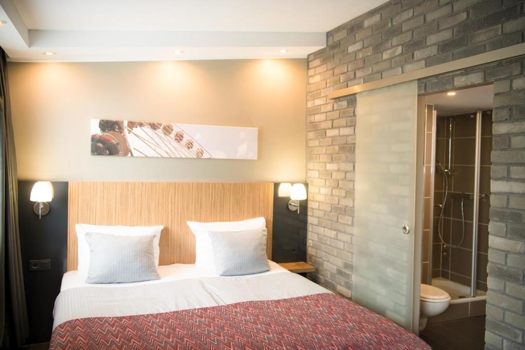 Postel nebo postele na pokoji v ubytování Hotel Munich City