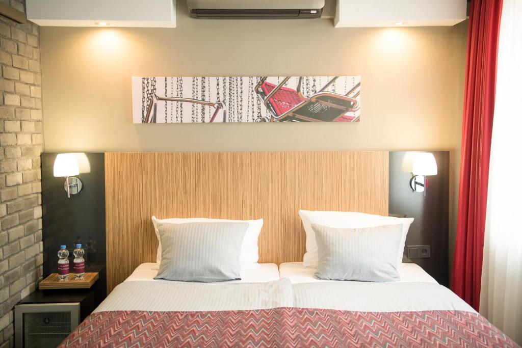 Postel nebo postele na pokoji v ubytování Hotel Munich City