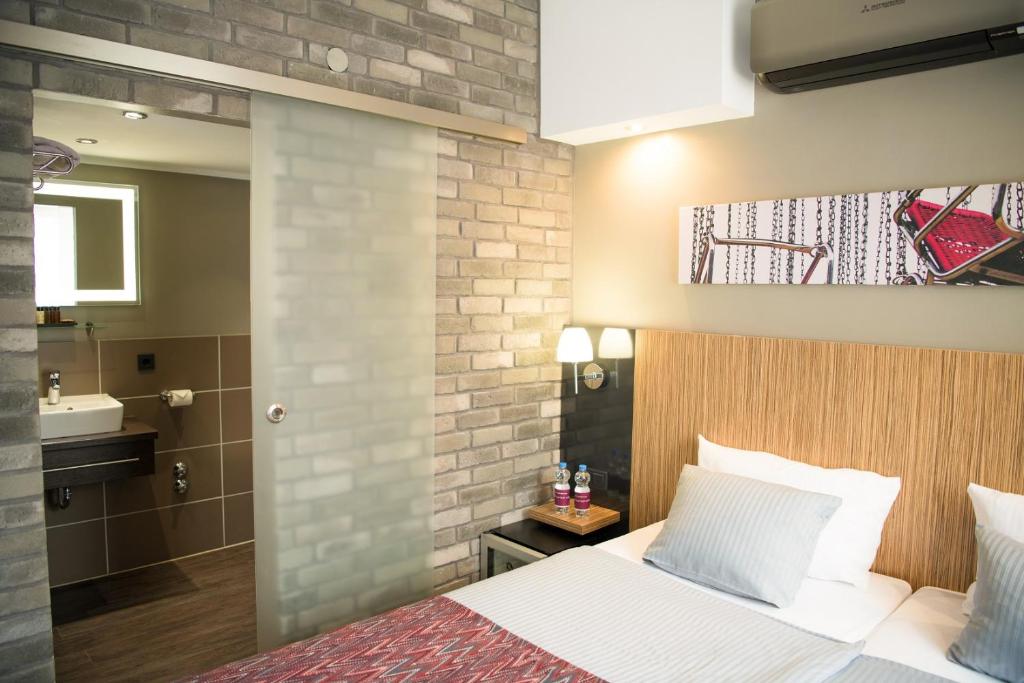 Postel nebo postele na pokoji v ubytování Hotel Munich City
