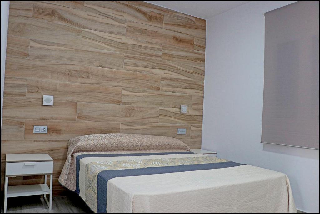 Łóżko lub łóżka w pokoju w obiekcie Bungalow La Roa V