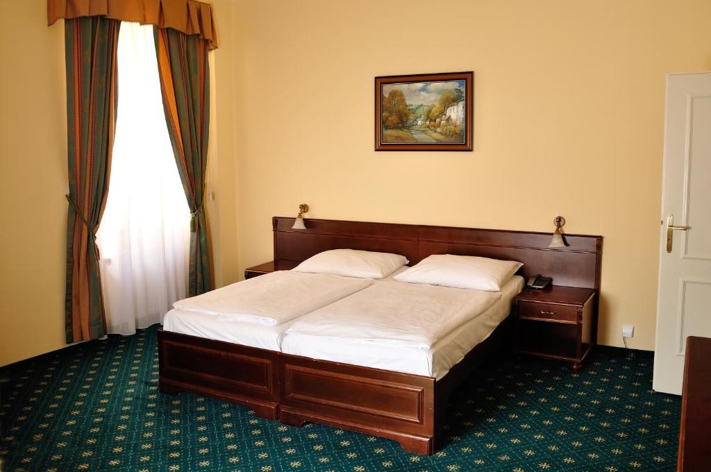 Postel nebo postele na pokoji v ubytování Hotel Certovka
