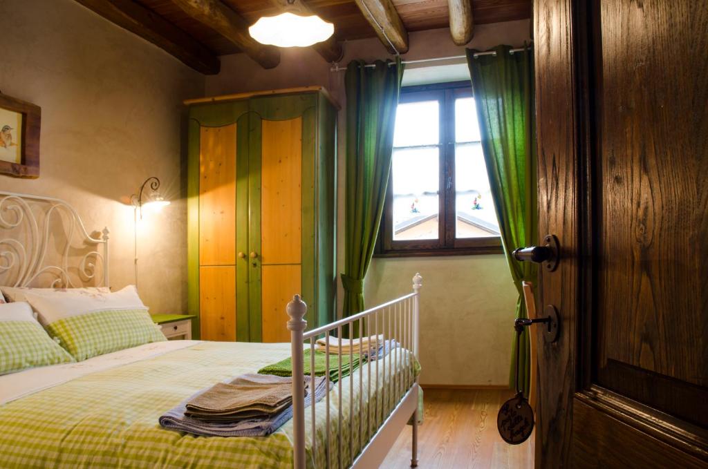 מיטה או מיטות בחדר ב-Agriturismo il posto delle fragole