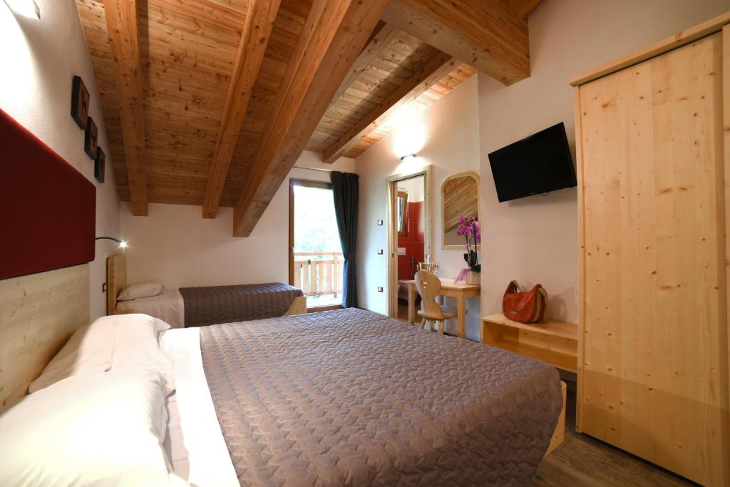Postel nebo postele na pokoji v ubytování Albergo Sporting