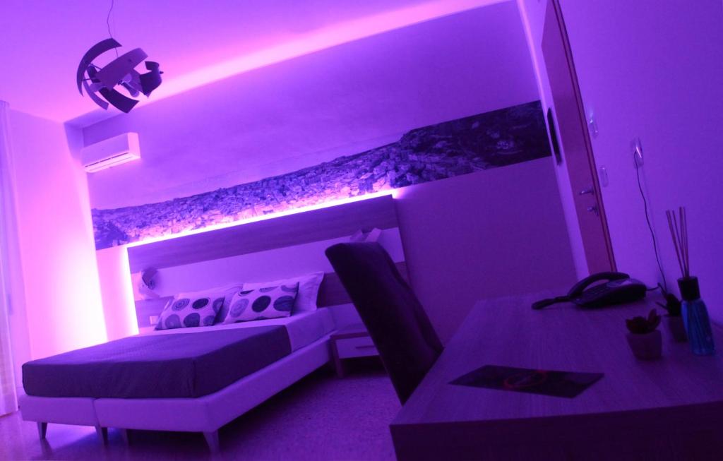 Postel nebo postele na pokoji v ubytování A'MANTIA HOTEL