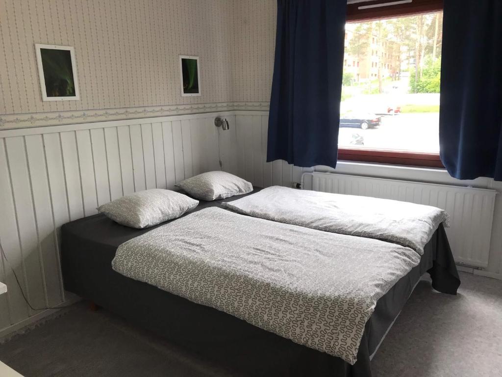 Postel nebo postele na pokoji v ubytování Guesthouse Borealis