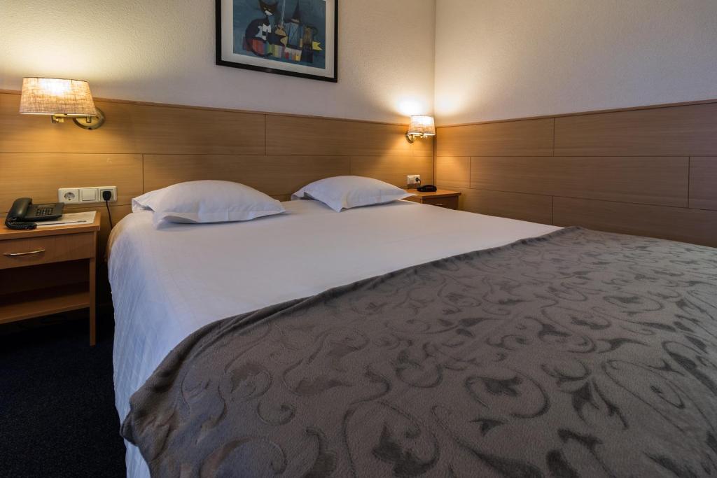 Postel nebo postele na pokoji v ubytování Hotel Edenpark