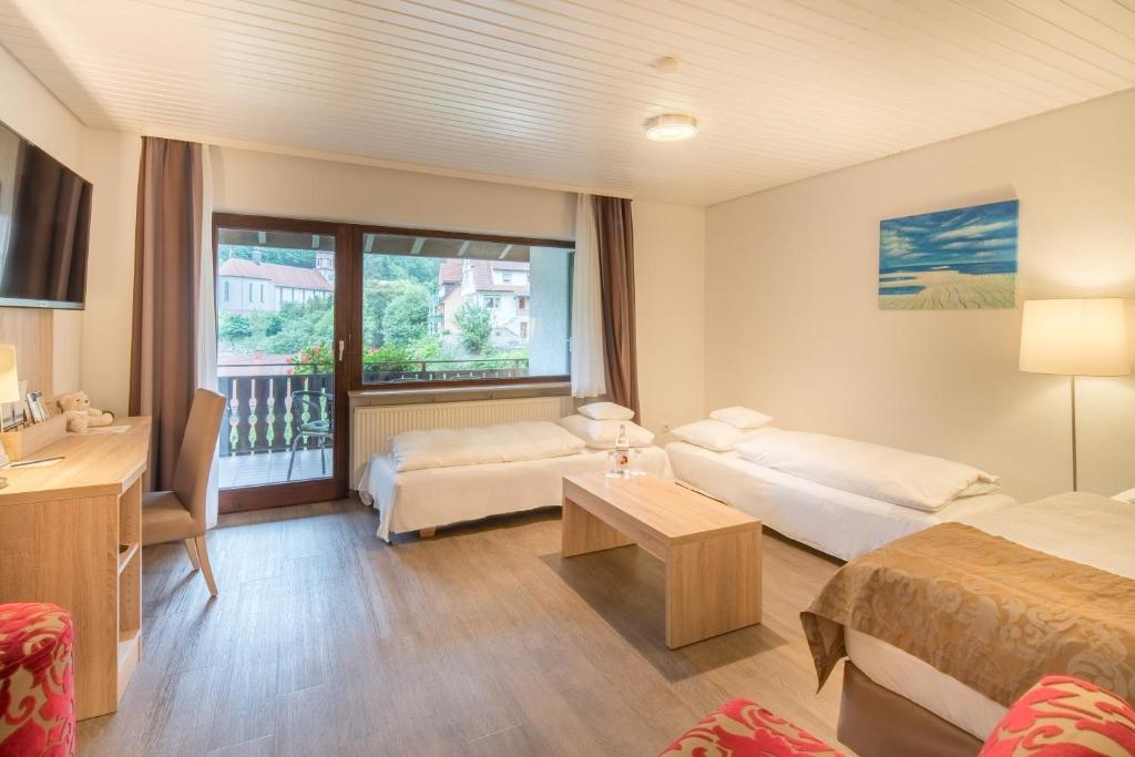 Postel nebo postele na pokoji v ubytování Best Western Plus Schwarzwald Residenz