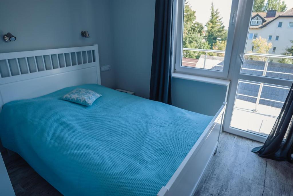 Postel nebo postele na pokoji v ubytování Na Leniwych Wodach