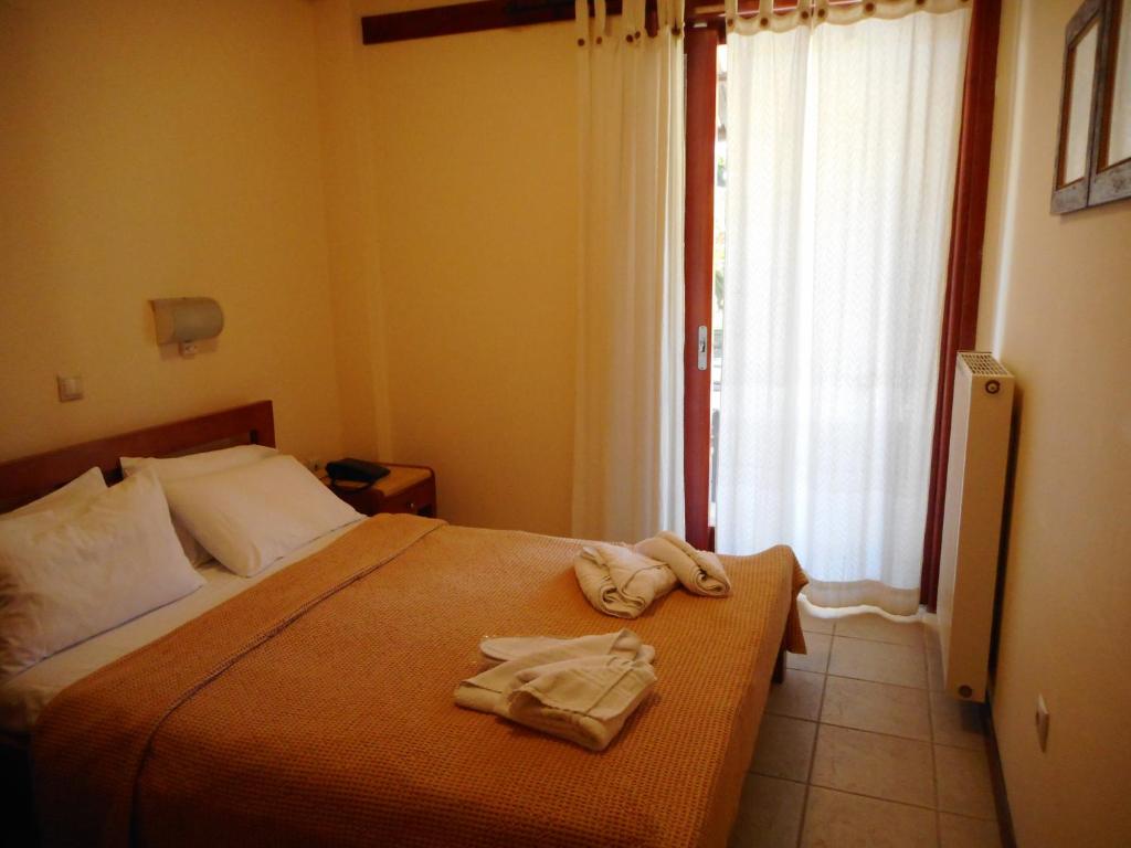 Postel nebo postele na pokoji v ubytování Akroyali Hotel & Villas