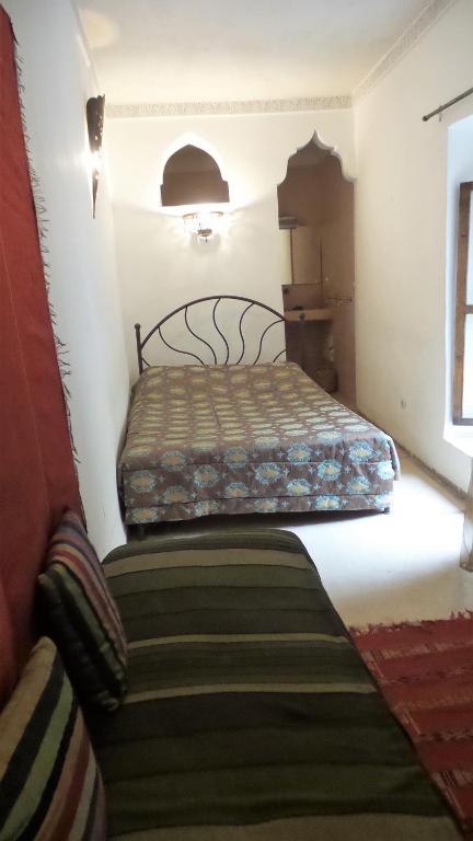 Postel nebo postele na pokoji v ubytování Riad Sabbah