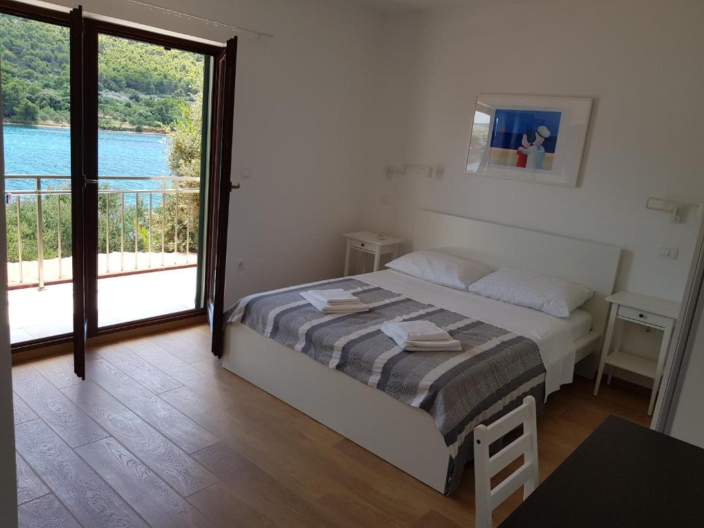 Postel nebo postele na pokoji v ubytování Apartments Vala