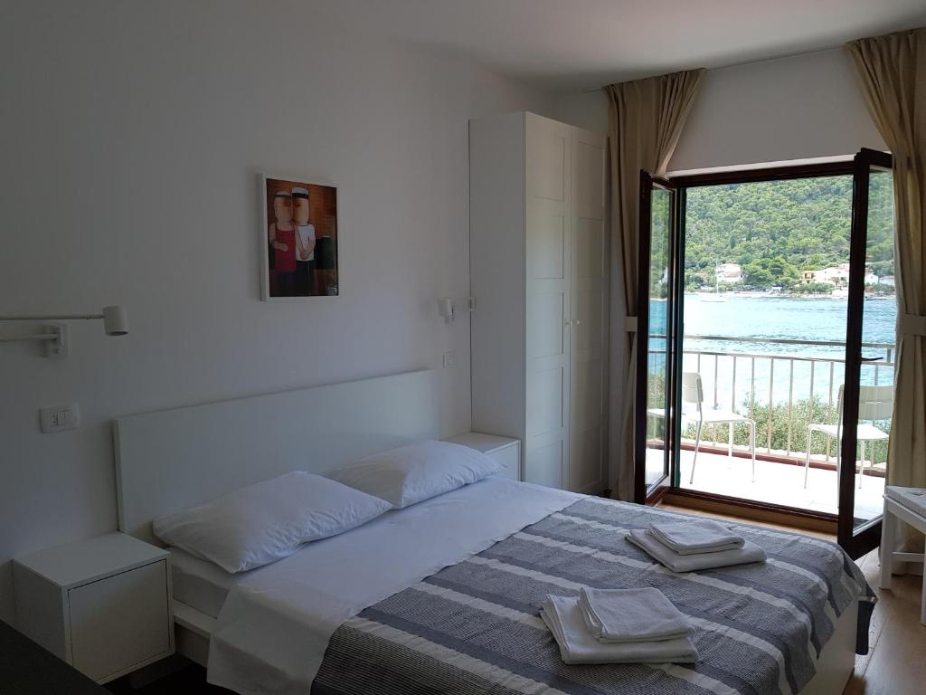 Postel nebo postele na pokoji v ubytování Apartments Vala