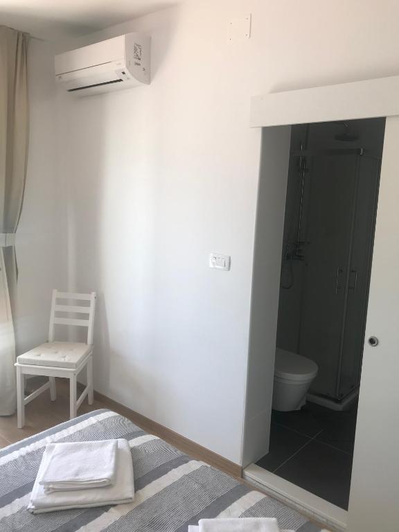 Postel nebo postele na pokoji v ubytování Apartments Vala