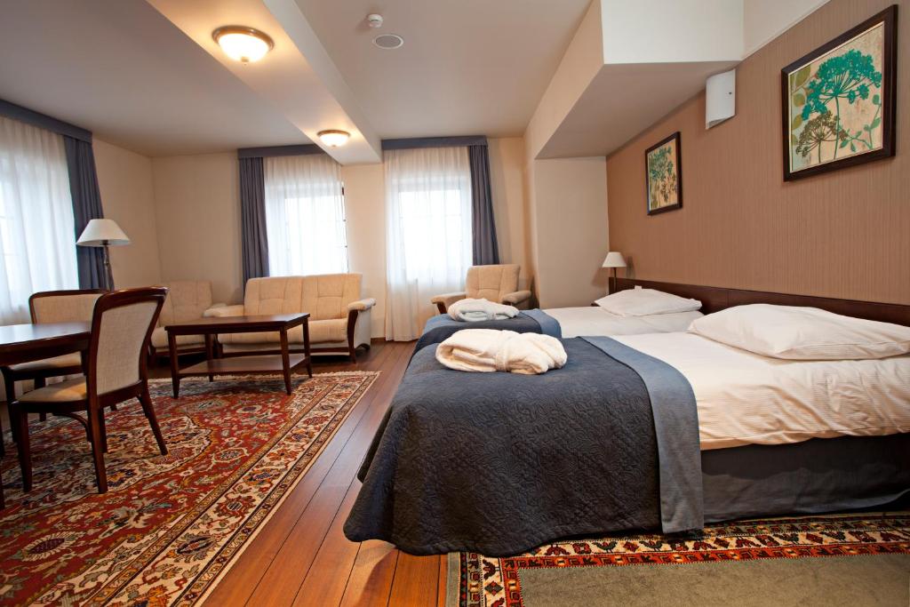 Posteľ alebo postele v izbe v ubytovaní Hotel Słoneczny Młyn