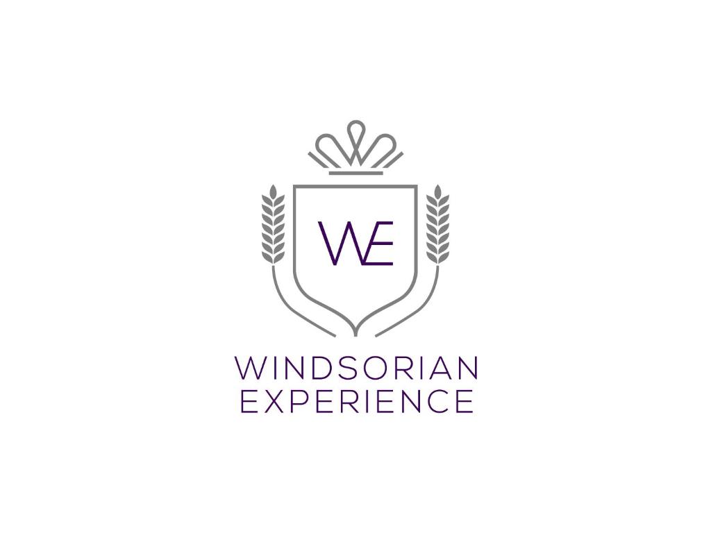 um logótipo para a experiência parabólica em Windsorian Experience em Windsor