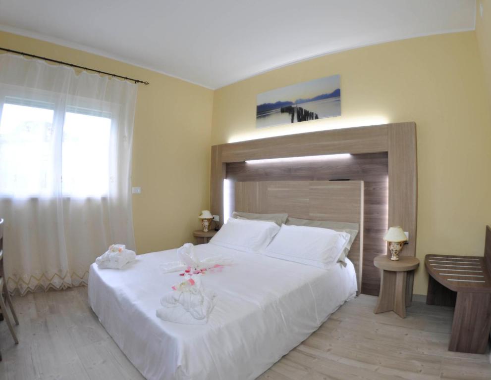 Postel nebo postele na pokoji v ubytování Cataleya Resort & Spa