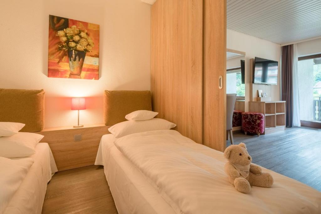 Postel nebo postele na pokoji v ubytování Best Western Plus Schwarzwald Residenz
