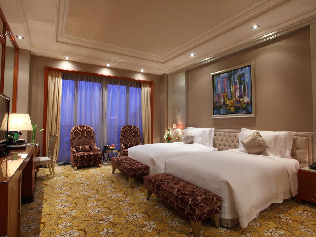 Postel nebo postele na pokoji v ubytování Chateau Star River Pudong Shanghai