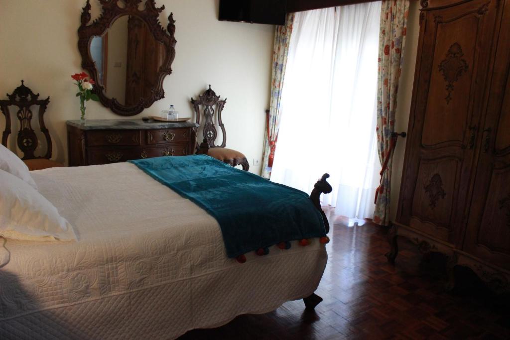 Postel nebo postele na pokoji v ubytování Graciosa Guest House