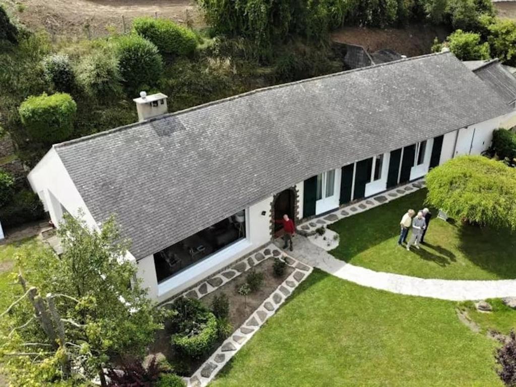 an aerial view of a house with people standing in the yard at Les Paridés in Boulogne-sur-Mer