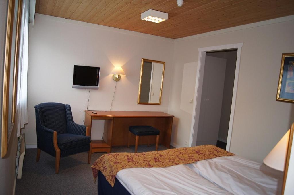 Postel nebo postele na pokoji v ubytování Rødberg Hotel