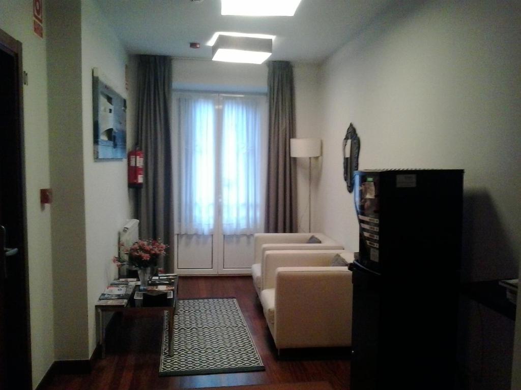 Televízia a/alebo spoločenská miestnosť v ubytovaní Hostal San Sebastian Centro