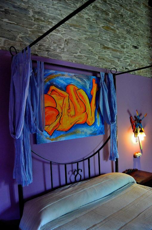 Postel nebo postele na pokoji v ubytování Casa de Baixo