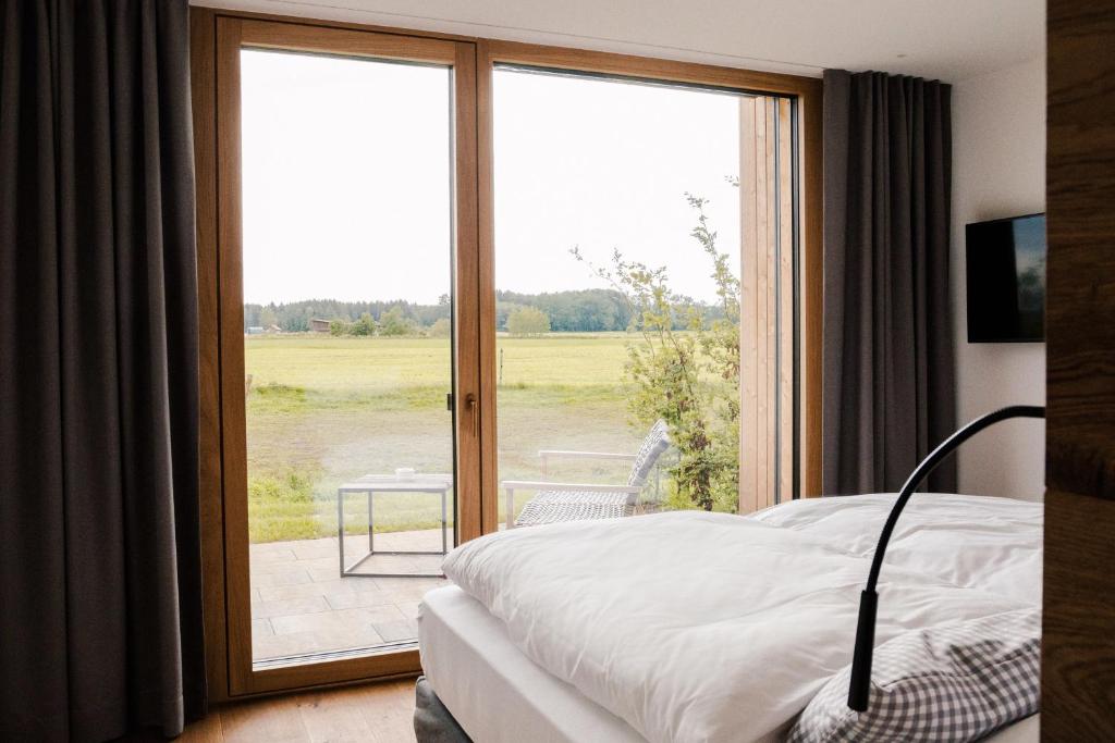 Postel nebo postele na pokoji v ubytování Hotel Lenderstuben