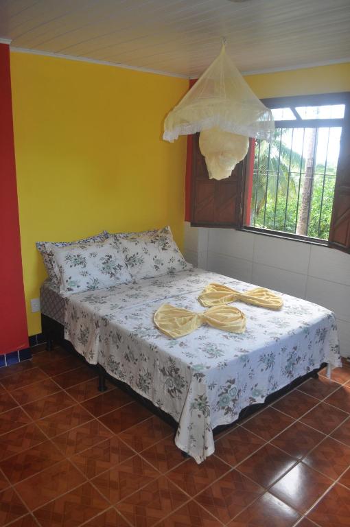 Uma cama ou camas num quarto em Sitio Os Tres