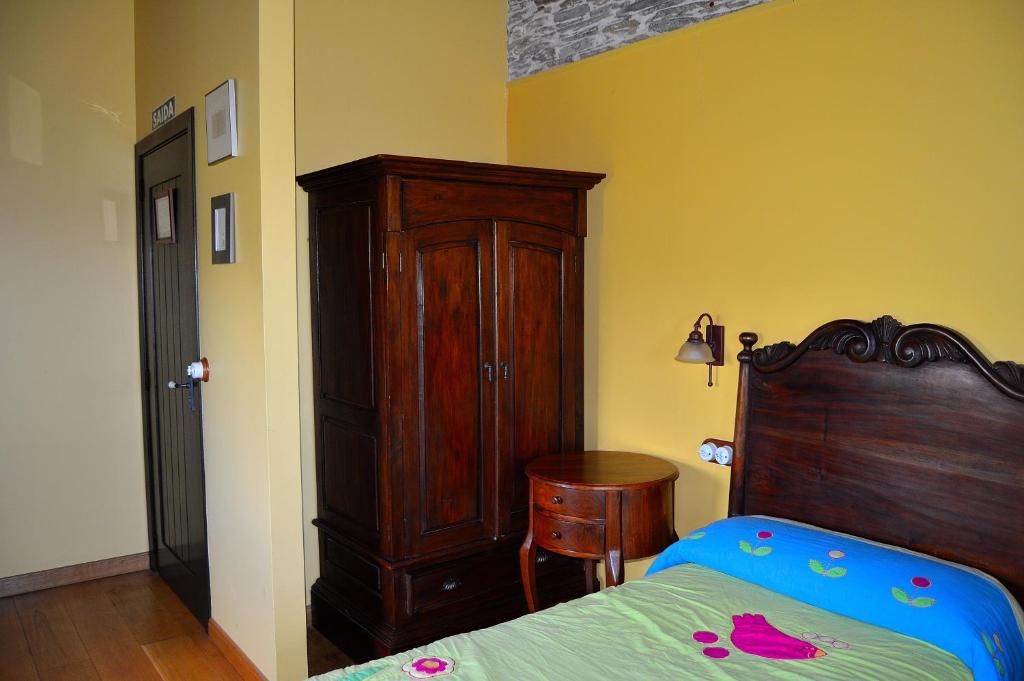 Postel nebo postele na pokoji v ubytování Casa de Baixo