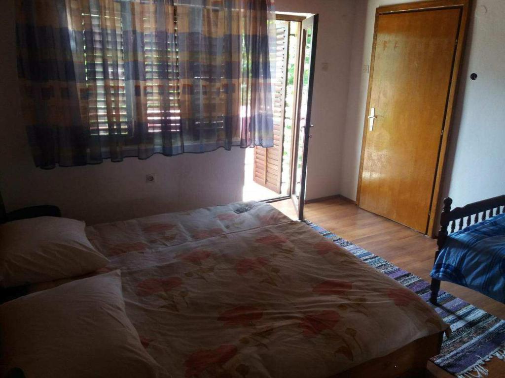 Säng eller sängar i ett rum på Apartman Trninic