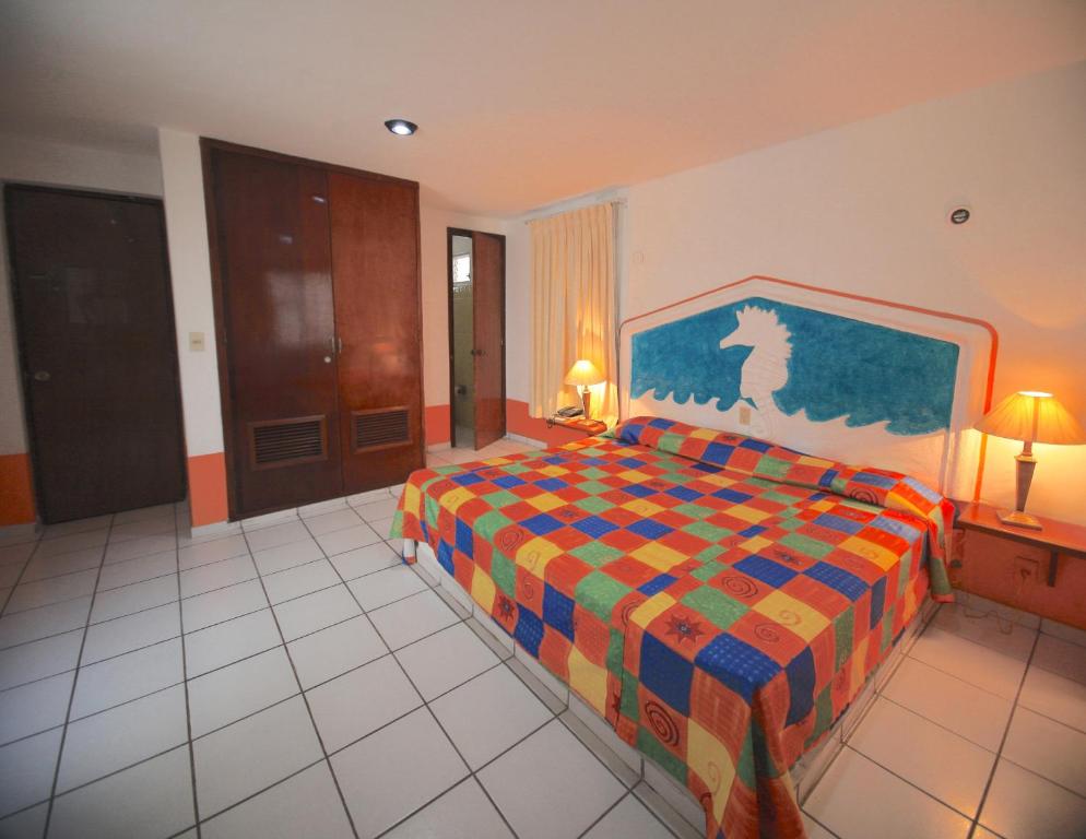 Postel nebo postele na pokoji v ubytování Hotel Carrillos Cancun