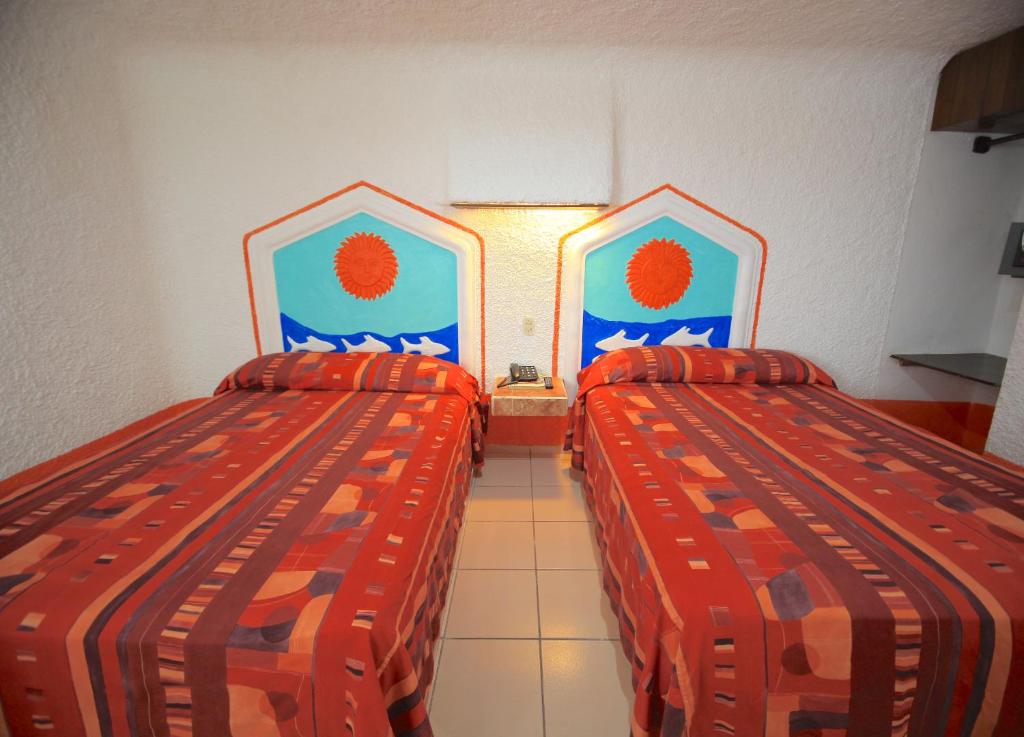 Postel nebo postele na pokoji v ubytování Hotel Carrillos Cancun
